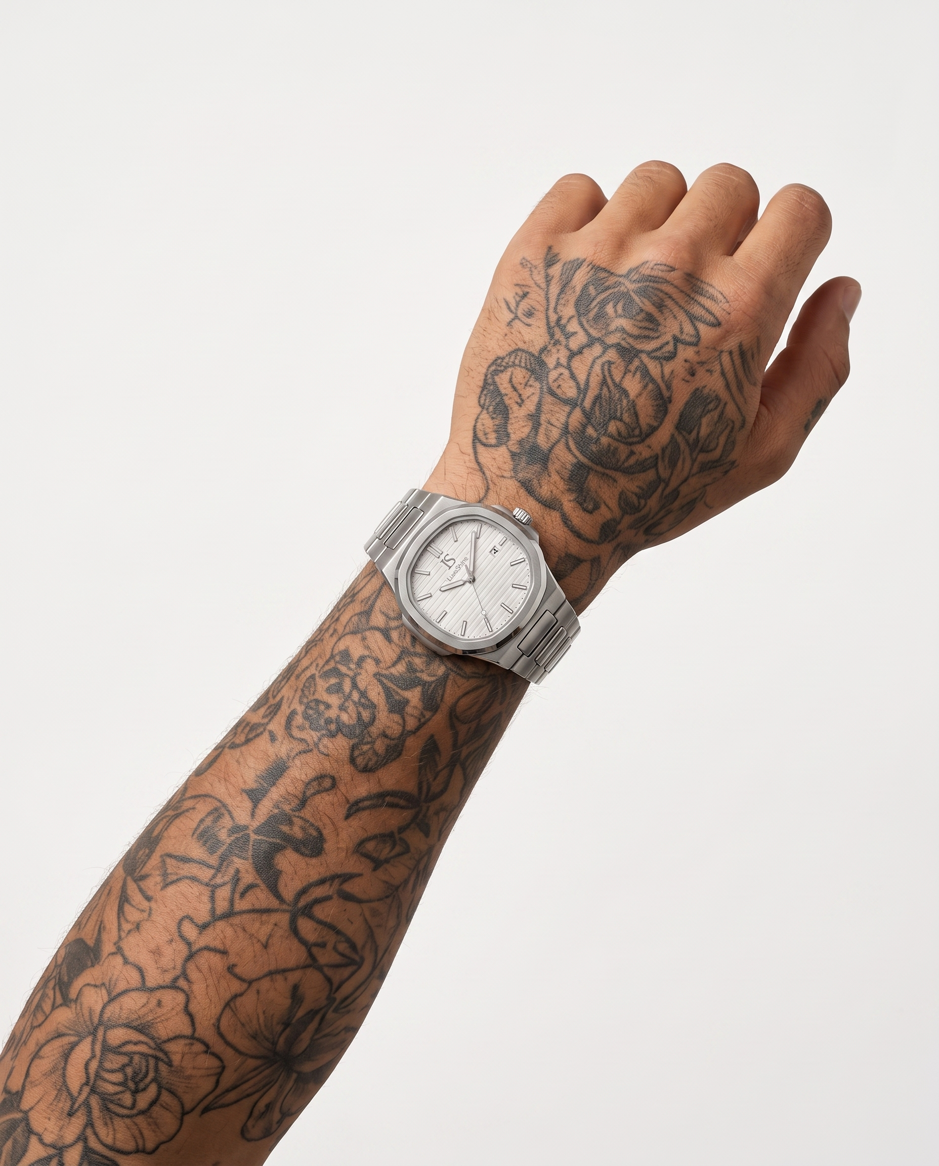 AI-GENERATED | source: Higgsfield nano_banana_2 | purpose: white-on-wrist-standard | product: CASPIAN | variant: Arctic Silver | variant_id: gid://shopify/ProductVariant/52455819018529 | model: approved-luxe-male-20260707 | date: 2026-07-10 | target: PDP gallery slot 2