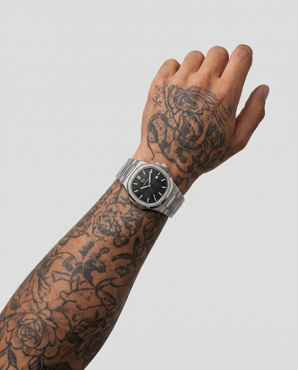 AI-GENERATED | source: Higgsfield nano_banana_2 | purpose: white-on-wrist-standard | product: CASPIAN | variant: Midnight Silver | variant_id: gid://shopify/ProductVariant/52455818952993 | model: approved-luxe-male-20260707 | date: 2026-07-10 | target: PDP gallery slot 2