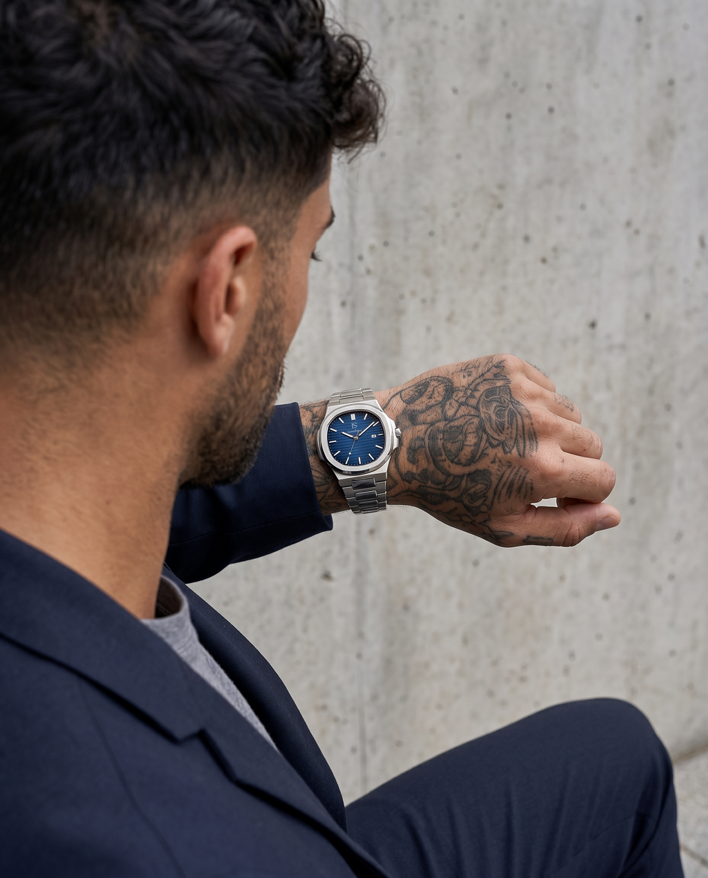 AI-GENERATED | source: Higgsfield nano_banana_2 | purpose: lifestyle-back | product: CASPIAN | variant: Royal Silver | variant_id: gid://shopify/ProductVariant/52455818985761 | model: approved-luxe-male-20260707 | date: 2026-07-10 | target: PDP gallery lifestyle
