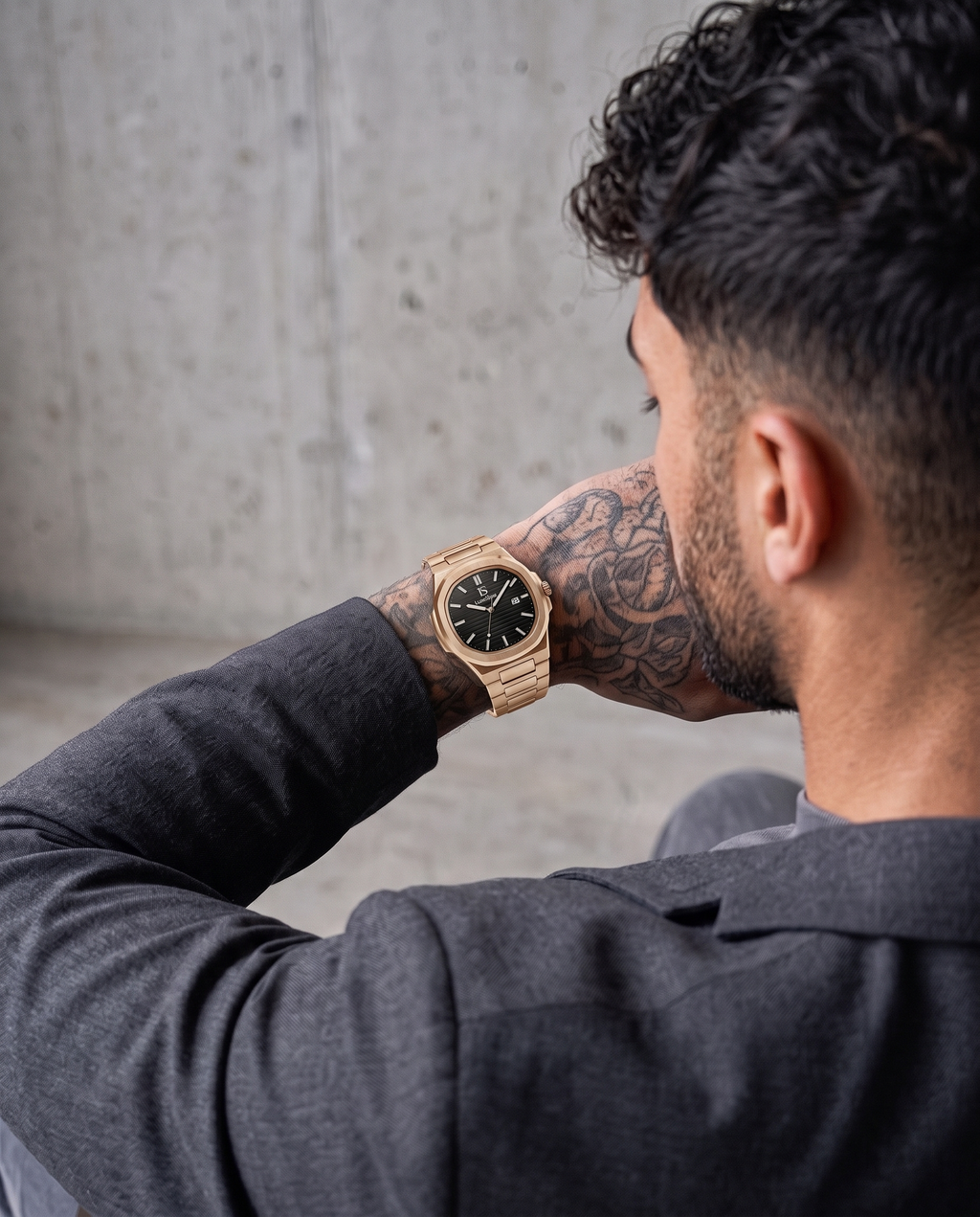 AI-GENERATED | source: Higgsfield nano_banana_2 | purpose: lifestyle-back | product: CASPIAN | variant: Midnight Gold | variant_id: gid://shopify/ProductVariant/52931297837345 | model: approved-luxe-male-20260707 | date: 2026-07-15 | target: PDP gallery lifestyle